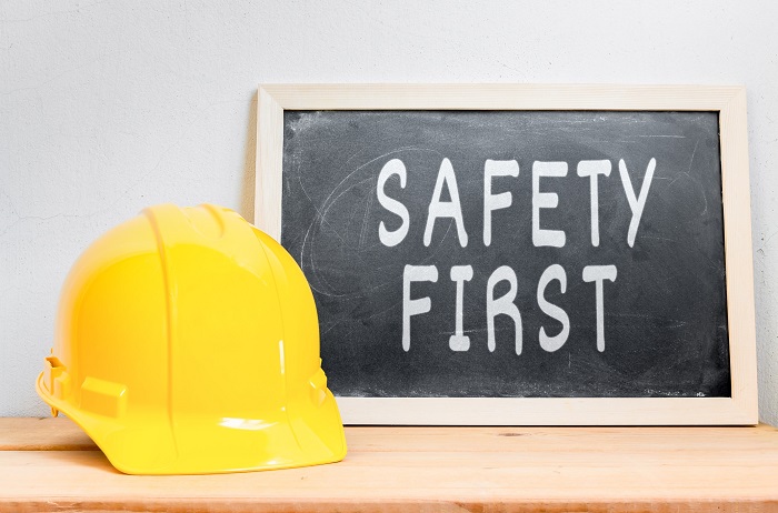 safety first sign with construction helmet